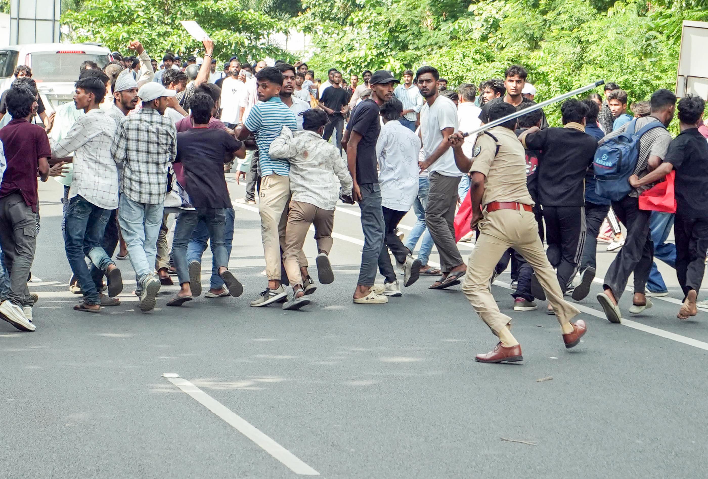 A policeman resorts to lathi charge at student march over irregularities in the NEET examination. (ANI) A policeman resorts to lathi charge at student march over irregularities in the NEET examination. (ANI)