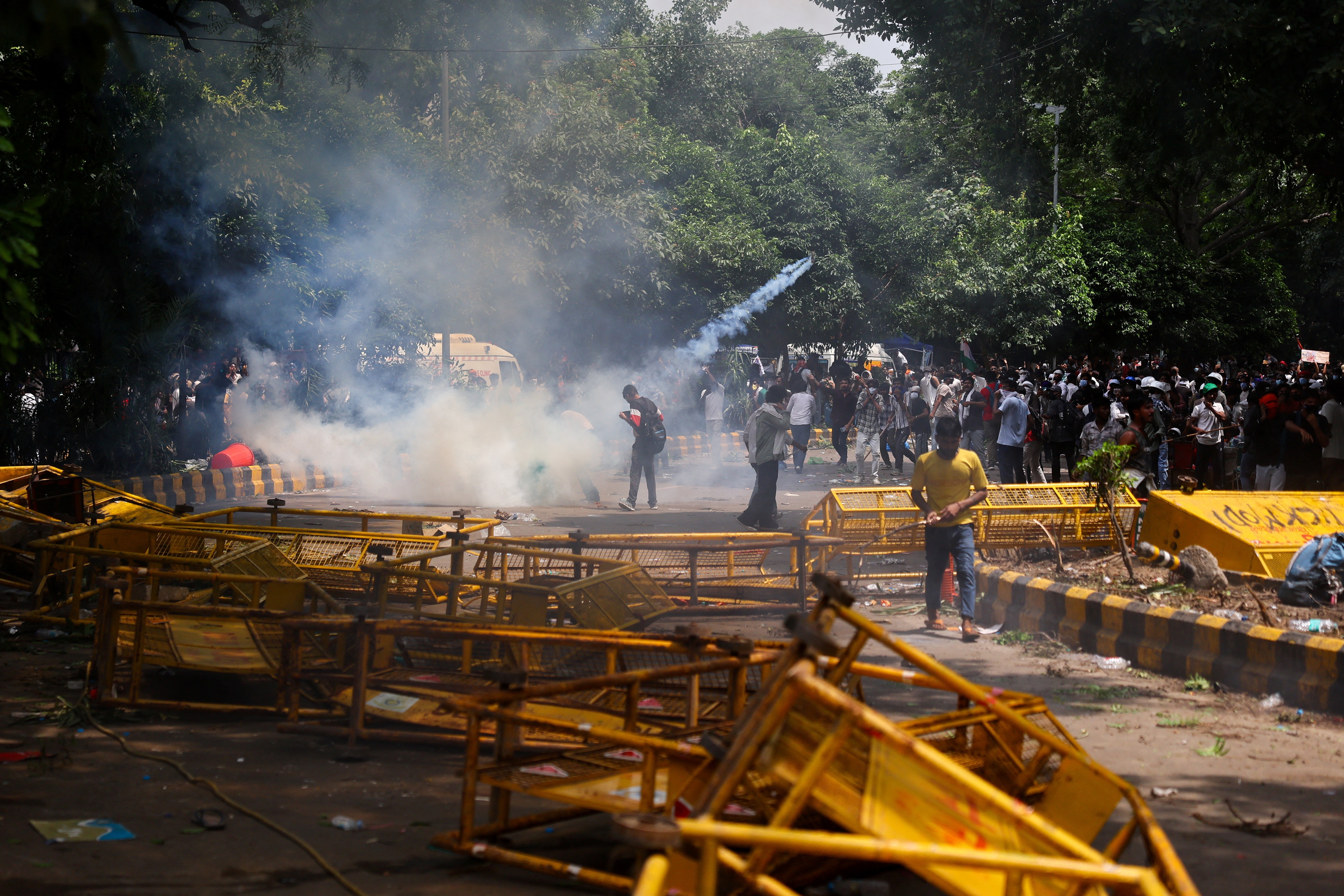 A tear gas can flies as supporters of Cockroach Janta Party demonstrate demanding the resignation of education minister Dharmendra Pradhan over exam paper leaks, in Delhi, July 25 (REUTERS)