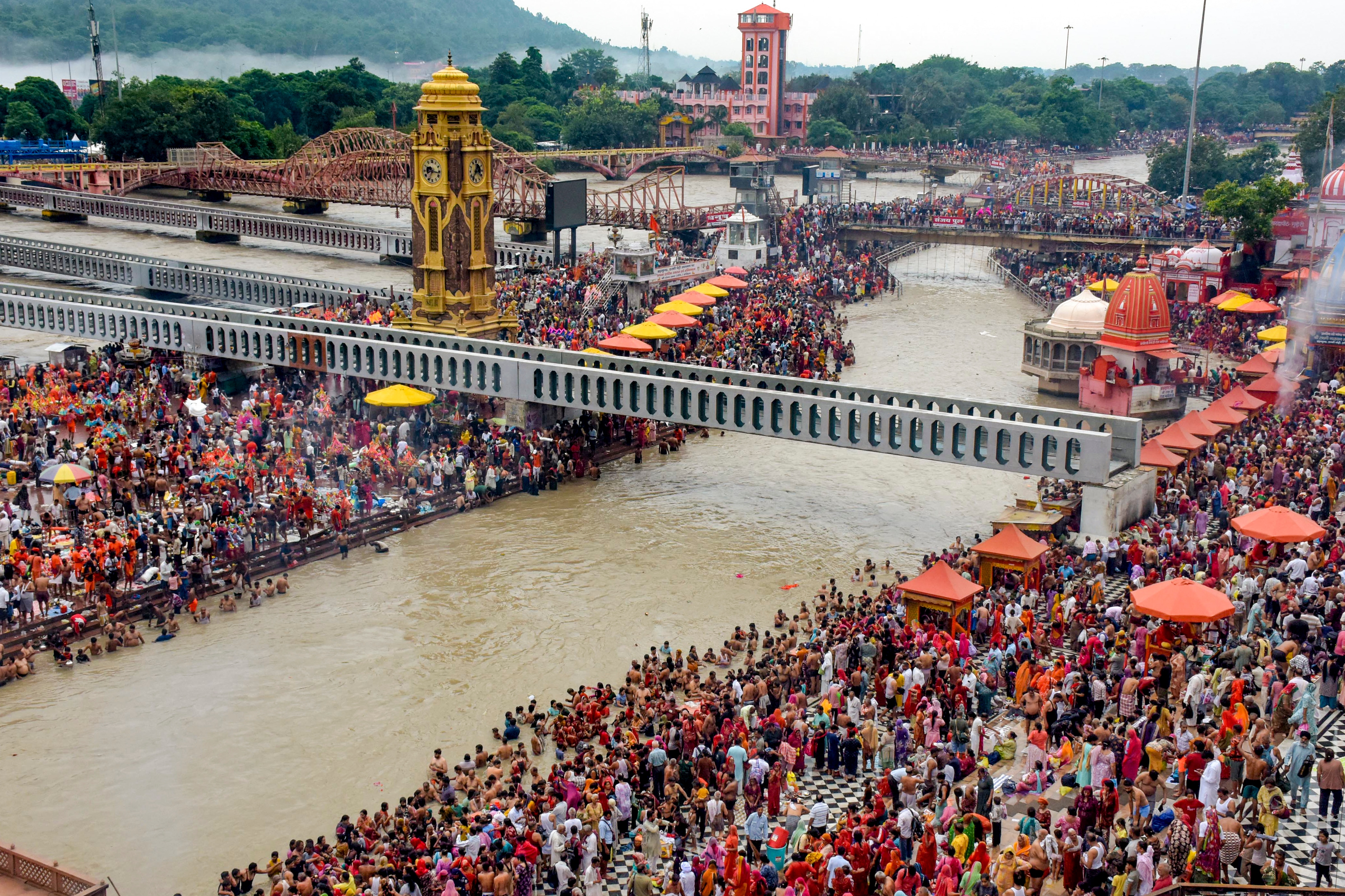 'Kanwariyas' and others take a holy dip in the Ganga river during the annual 'Kanwar Yatra', at Har Ki Pauri, in Haridwar, Uttarakhand. (PTI) 'Kanwariyas' and others take a holy dip in the Ganga river during the annual 'Kanwar Yatra', at Har Ki Pauri, in Haridwar, Uttarakhand. (PTI)