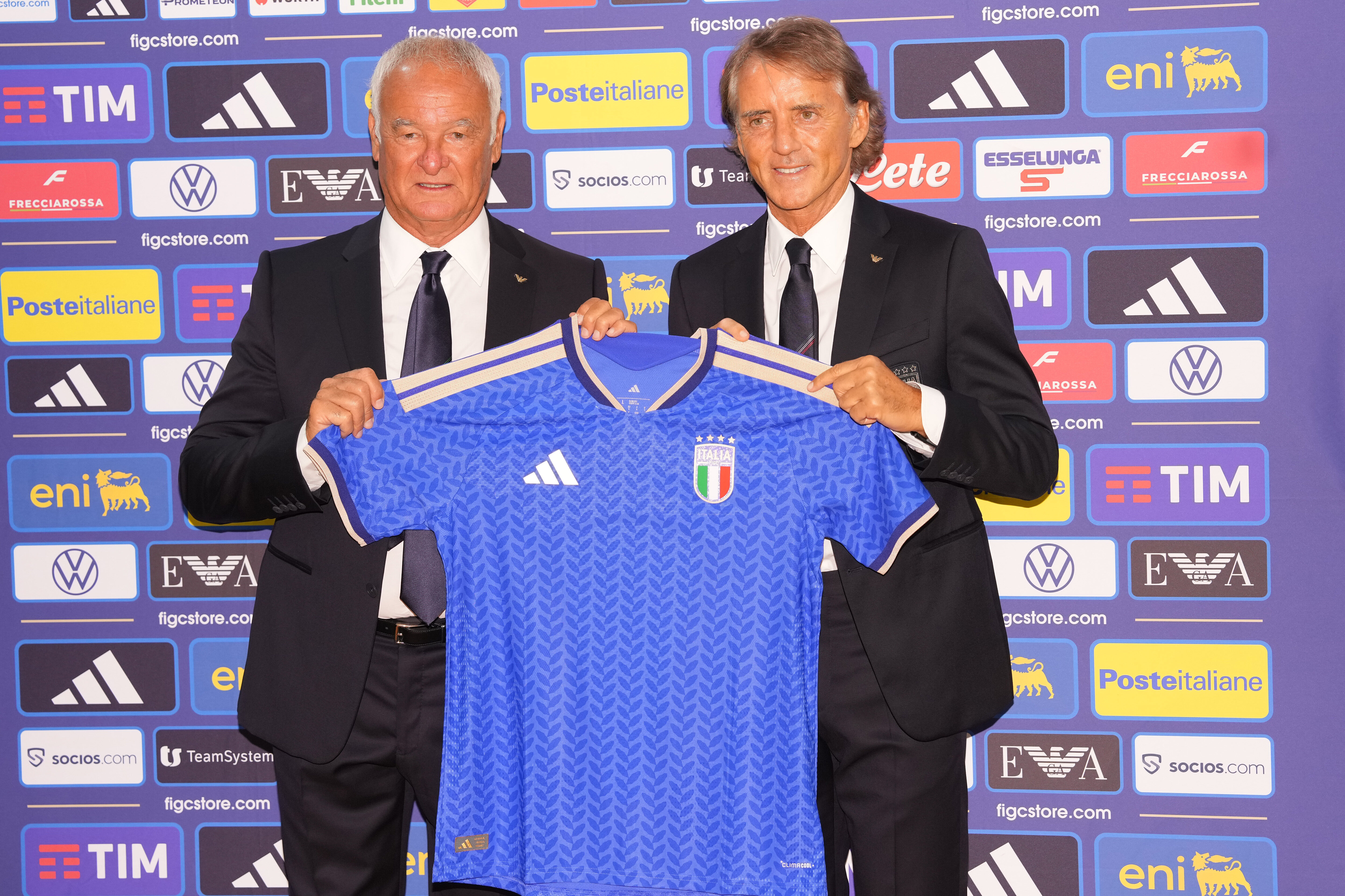 Italy's new coach Roberto Mancini (right), and new technical director Claudio Ranieri pose during a news conference in Rome on Wednesday. (AP) Italy's new coach Roberto Mancini (right), and new technical director Claudio Ranieri pose during a news conference in Rome on Wednesday. (AP)