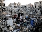 Palestinians inspect the debris following an Israeli airstrike the day before in Gaza City, Gaza, on Thursday, July 30, 2026.