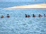 Farmers led by an association form a human chain as they wade into Cauvery river to protest over water dispute, in Tiruchirappalli district of Tamil Nadu.