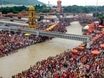 'Kanwariyas' and others take a holy dip in the Ganga river during the annual 'Kanwar Yatra', at Har Ki Pauri, in Haridwar, Uttarakhand.