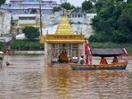 Jabalpur: People cross the swollen Narmada river on a boat after heavy rain, at Gwarighat in Jabalpur, Madhya Pradesh, Thursday, July 30, 2026. (PTI Photo)(PTI07_30_2026_000289B)