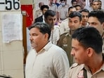 Former AAP councillor Tahir Hussain being escorted by police personnel as he leaves after a hearing in the case of the murder of Intelligence Bureau officer Ankit Sharma during the 2020 Delhi riots.