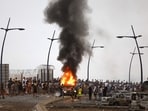 A vehicle burns at the site of clashes near Fnideq, on the Morocco-Spain border Cueta.