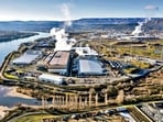 Vapour rises as a result of cooling operations at an AI data centre campus along the Columbia River in Oregon. (Adobe Stock)