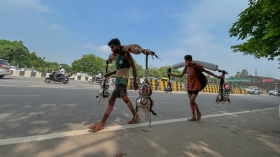 A Kanwariya carrying holy water from the Ganga River Haridwar on his shoulders while returning to Firozpur Jhirka in Nuh district during the Kanwar Yatra A Kanwariya carrying holy water from the Ganga River Haridwar on his shoulders while returning to Firozpur Jhirka in Nuh district during the Kanwar Yatra
