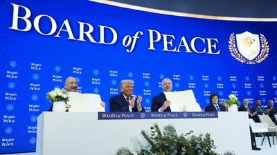US President Donald Trump and other leaders hold up their signed Board of Peace charter during the Annual Meeting of the World Economic Forum (AP Photo/Evan Vucci) US President Donald Trump and other leaders hold up their signed Board of Peace charter during the Annual Meeting of the World Economic Forum (AP Photo/Evan Vucci)