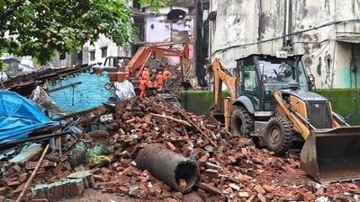 Mud, Debris and earthmoving machinery at the site as rescue personnel conduct rescue operations in Bhiwandi, Maharashtra, (PTI)