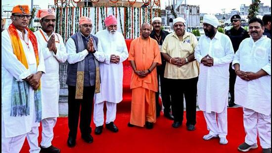 Chief minister Yogi Adityanath and others at Seer Govardhan village in Varanasi on July 29. (PTI)