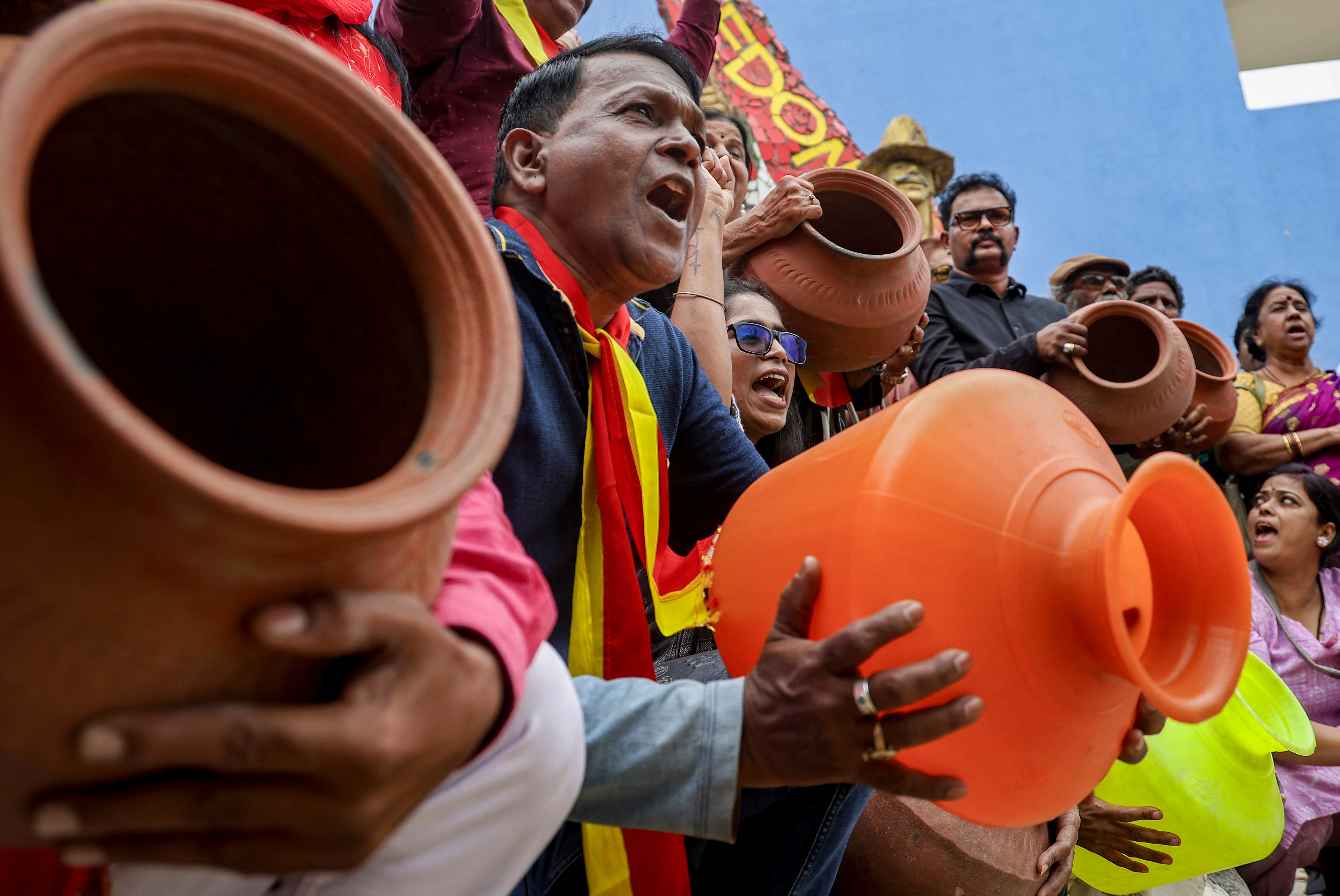 Demonstrators holding empty pots raise slogans and protest against the Cauvery Water Regulation Committee's order to release water to Tamil Nadu, in Bengaluru. (PTI) Demonstrators holding empty pots raise slogans and protest against the Cauvery Water Regulation Committee's order to release water to Tamil Nadu, in Bengaluru. (PTI)