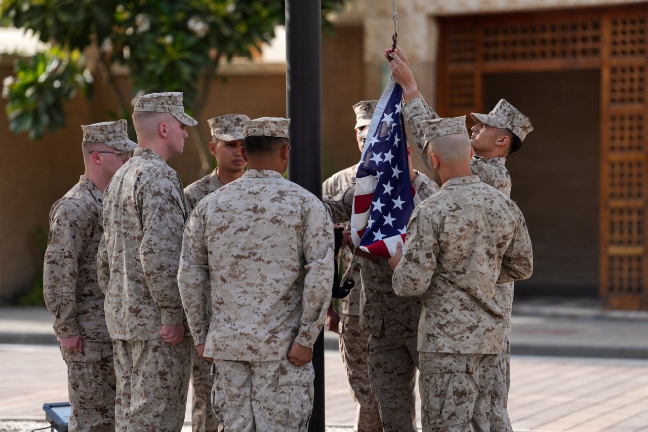 U.S. servicemembers raising the American flag last month at the U.S. Embassy in Kuwait. U.S. servicemembers raising the American flag last month at the U.S. Embassy in Kuwait.