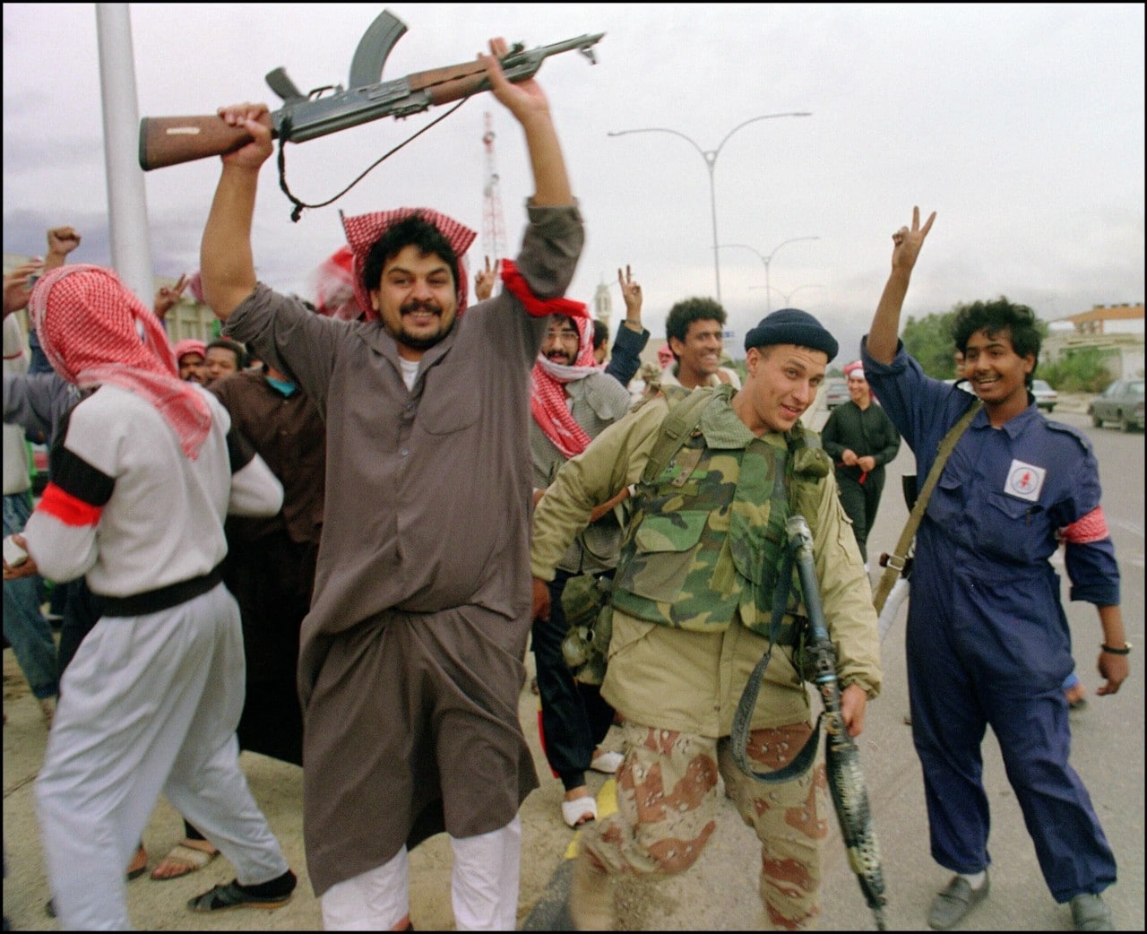 Kuwaiti resistance fighters celebrated with a U.S. serviceman after American forces entered a town in 1991. Kuwaiti resistance fighters celebrated with a U.S. serviceman after American forces entered a town in 1991.