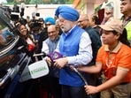Union minister for petroleum and natural gas Hardeep Singh Puri fills E85 fuel in a car during the during the launch of E85 fuel (a blend of 85% ethanol and 15% petrol) in New Delhi.