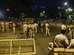 Police personnel stand guard at the protest site after CJP protest concludes, at Jantar Mantar in New Delhi.