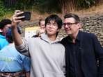 Britain's Prime Minister Andy Burnham has a selfie taken during a visit to a family center in Sheffield, England, Friday, July 31, 2026.