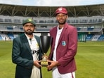 Roston Chase and Babar Azam posing with the trophy. Roston Chase and Babar Azam posing with the trophy.