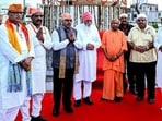 Chief minister Yogi Adityanath and others at Seer Govardhan village in Varanasi on July 29. (PTI)