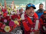 File photo of Nepal's climber Nirmal Purja (C) with his team after becoming the firsts to summit Pakistan's K2 mountain in winter, in Islamabad on January 21, 2021.