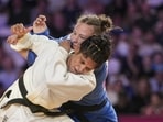 India's Unnati Sharma, in white, competes against Australia's Saya Middleton during a women's 63kg semifinal Judo match at the 23rd Commonwealth Games. (PTI)