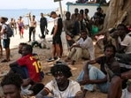 Migrants gather in Ceuta, Spain, following recent mass crossings of migrants on foot and by sea from Morocco into Spanish territory.