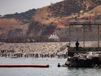 Migrants head back to Morocco after crossing into Ceuta by sea amid mass crossings of migrants on foot and by sea from Morocco into Spanish territory, in Ceuta, Spain, August 1, 2026.