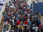 Police officers and Spanish soldiers escort a big group of migrants to the border to take them out of Spain, after mass crossings of migrants on foot and by sea from Morocco into Spanish territory, in Ceuta, Spain, August 1, 2026.(REUTERS)