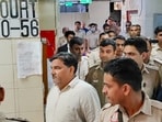 Former AAP councillor Tahir Hussain being escorted by police personnel as he leaves after a hearing in the case of the murder of Intelligence Bureau officer Ankit Sharma during the 2020 Delhi riots, 