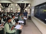 Students attending a class using an interactive panel at a Meritorious School in Ludhiana on Saturday. (HT PHOTO)