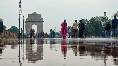 Gram it: Be prepared to witness a wet Sunday and see the city in a new light just like this reflection of India Gate that is seen on a glistening road after a rainfall. (Photo: ANI)
