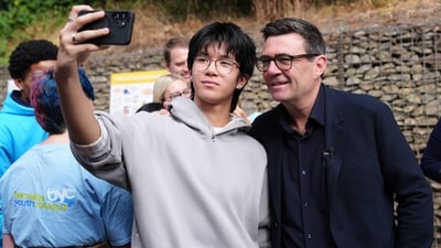 Britain's Prime Minister Andy Burnham has a selfie taken during a visit to a family center in Sheffield, England, Friday, July 31, 2026. (AP) Britain's Prime Minister Andy Burnham has a selfie taken during a visit to a family center in Sheffield, England, Friday, July 31, 2026. (AP)