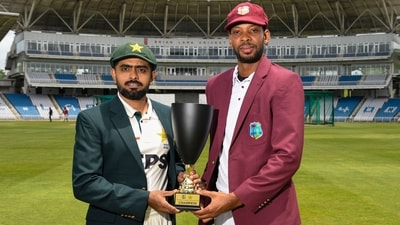 Roston Chase and Babar Azam posing with the trophy. (AFP) Roston Chase and Babar Azam posing with the trophy. (AFP)