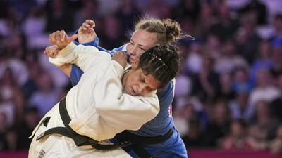 India's Unnati Sharma, in white, competes against Australia's Saya Middleton during a women's 63kg semifinal Judo match at the 23rd Commonwealth Games. (PTI) India's Unnati Sharma, in white, competes against Australia's Saya Middleton during a women's 63kg semifinal Judo match at the 23rd Commonwealth Games. (PTI)