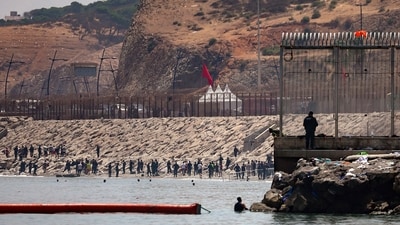 Migrants head back to Morocco after crossing into Ceuta by sea amid mass crossings of migrants on foot and by sea from Morocco into Spanish territory, in Ceuta, Spain, August 1, 2026. (REUTERS)