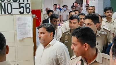 Former AAP councillor Tahir Hussain being escorted by police personnel as he leaves after a hearing in the case of the murder of Intelligence Bureau officer Ankit Sharma during the 2020 Delhi riots, (PTI)