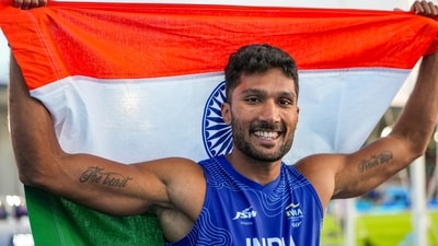 India's Tejaswin Shankar celebrates with the national flag after winning the bronze medal in the men's decathlon event at Commonwealth Games 2026. (PTI) India's Tejaswin Shankar celebrates with the national flag after winning the bronze medal in the men's decathlon event at Commonwealth Games 2026. (PTI)
