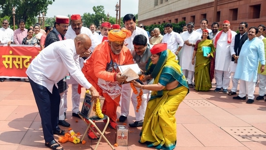 Opposition MPs stage a symbolic 'chanda chori' protest with donation boxes in the Parliament complex over the alleged theft of offerings at the Ram Temple in Ayodhya. (Rahul Singh/ ANI )