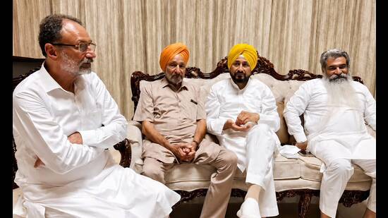 Charanjit Singh Channi and other party functionaries at former Ghanaur MLA Madan Lal Jalalpur’s residence on Saturday. (HT)