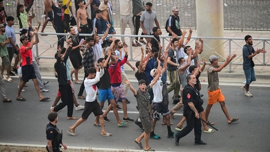 Spanish police cracks down on migrants to send them back amid a political battle.