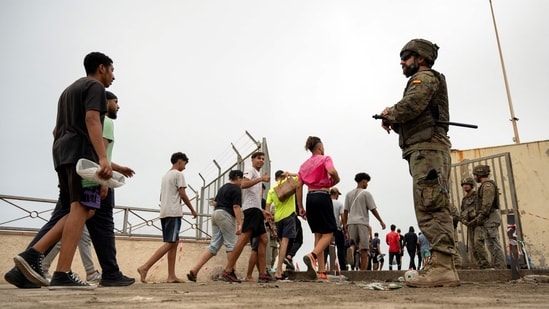 Several videos circulating on social media show Moroccan migrants reportedly crossing into Ceuta. (File Photo/AFP)