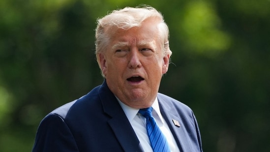 US President Donald Trump gestures before boarding Marine One as he departs Camp David in Maryland, on July 31, 2026, following a Cabinet meeting.