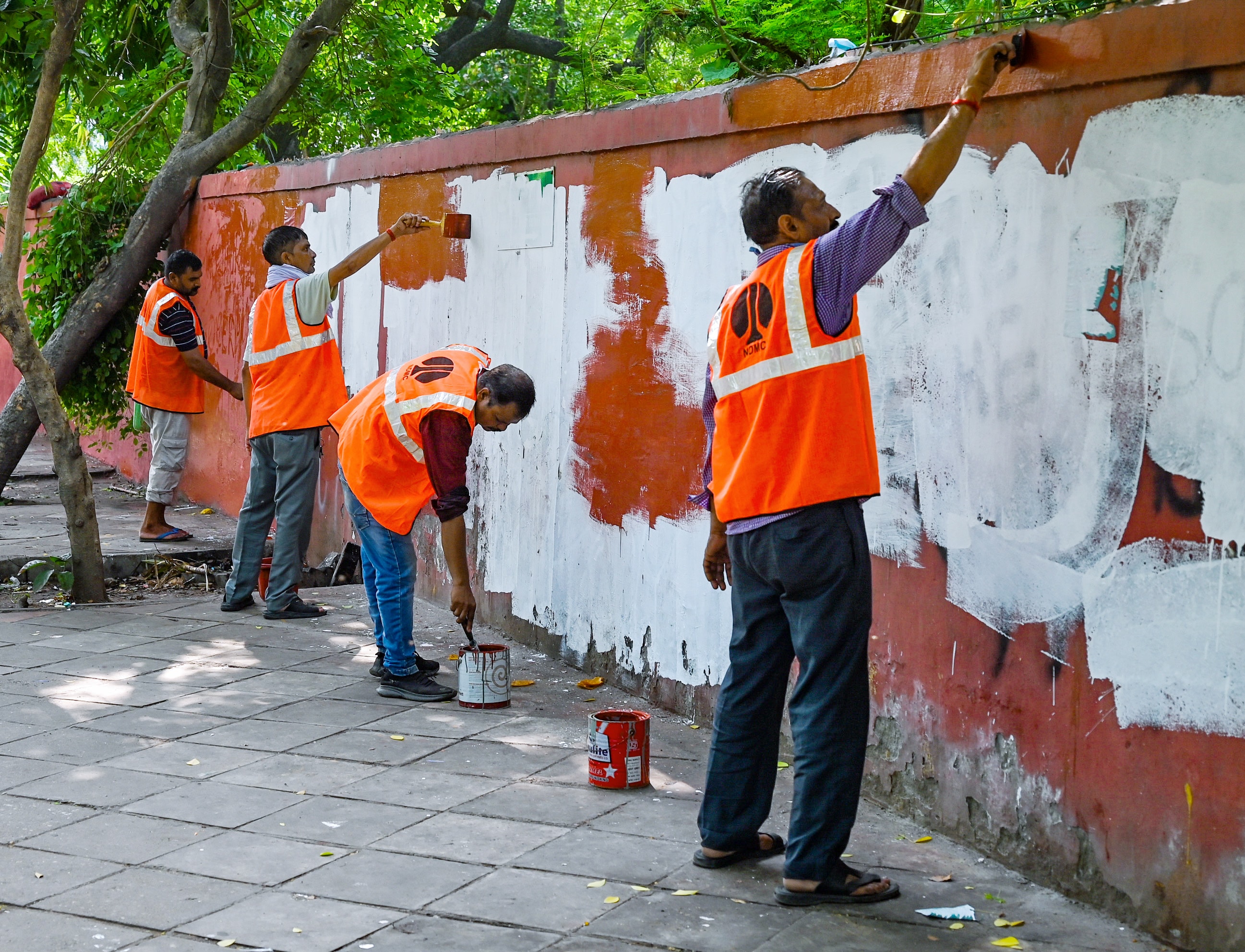 NDMC workers paint the walls at the Cockroach Janta Party (CJP) protest site at Jantar Mantar after the party called off its agitation following the resignation of Dharmendra Pradhan as Union Education Minister, in New Delhi on Sunday. (ANI) NDMC workers paint the walls at the Cockroach Janta Party (CJP) protest site at Jantar Mantar after the party called off its agitation following the resignation of Dharmendra Pradhan as Union Education Minister, in New Delhi on Sunday. (ANI)