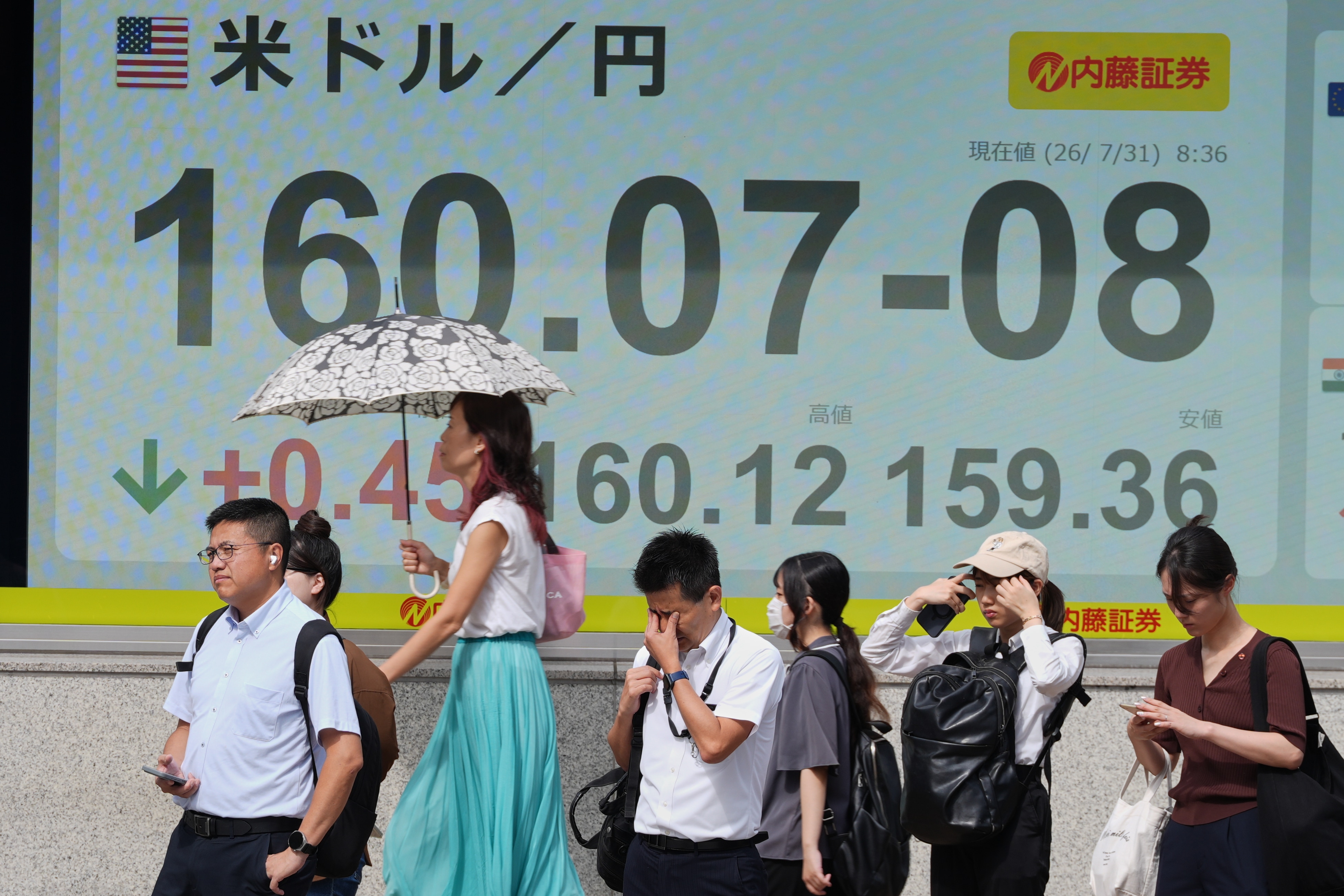 A board shows Japanese Yen and US dollar exchange rate at a securities firm. (AP Photo) A board shows Japanese Yen and US dollar exchange rate at a securities firm. (AP Photo)