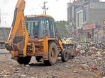 Garbage being cleared in Ludhiana on Sunday. (Gurpreet Singh/HT)