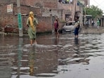 Overflowing sewage on the streets and road in bad condition in Tajour area in Ludhiana on Sunday. (Gurpreet Singh/HT)
