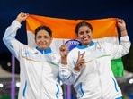 Sharmila Dhankar, left, and Shilpa K Shyla celebrate after winning gold and bronze medals respectively in the women's shot put F57 at the 23rd Commonwealth Games, in Glasgow
