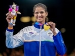 India's Jaismine Lamboria clinches a gold medal after winning against Northern Ireland's Michaela Walsh during the Women's 57kg boxing final