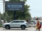 The LED board at Sohna Chowk reads vehicle numbers and instantly shows pending challans using the e-challan database. (Parveen Kumar/HT)