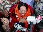 Weightlifter Mirabai Chanu is being received on arrival in New Delhi on Sunday after winning the 48kg gold at the Glasgow Commonwealth Games. (ANI)